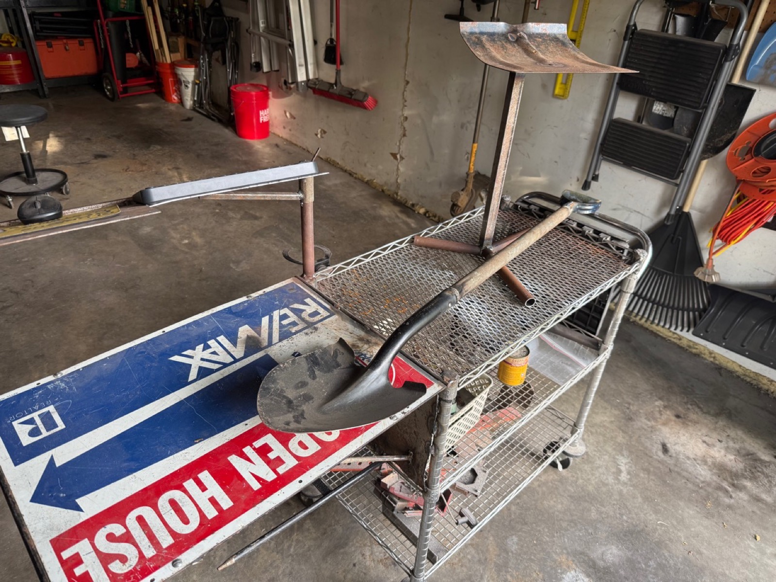 Shop-built welded tool and shovel stand on a garage work cart
